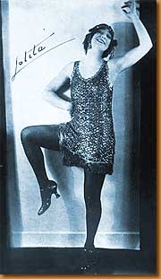 The gregarious flapper.  Note the bobbed hair - also a break from the past and a sign of her freedom.